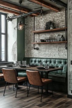 a restaurant with brick walls and green leather booths