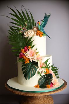 A three-tiered tropical-themed wedding cake with a cascade of sugar palm leaves and tropical flowers cascading down the sides of the cake. The top tier is adorned with a sugar sculpture of a parrot sitting on a sugar pineapple. The second tier has sugar orchids and hibiscus flowers adorning it and the base tier has leaves of sugar monstera and sugar ferns. Vibrant Tropical Wedding, Tropical Themed Wedding, Tropical Wedding Cake, Cake Boutique, Cake Artist, Tropical Wedding, Tropical Flowers, Wedding Cake, Flamingo