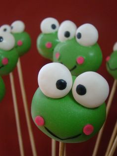 some green cake pops with googly eyes on them