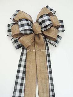 a black and white checkered bow hanging on a wall