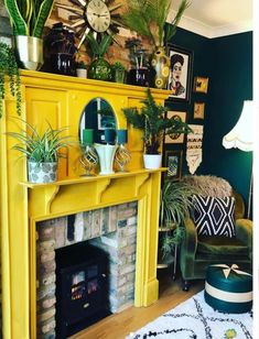 a living room filled with furniture and a fire place covered in potted greenery