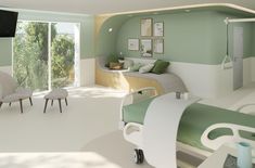 a hospital room with green and white decor on the walls, bed in the middle