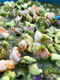 shrimp and avocado soup in a blue bowl