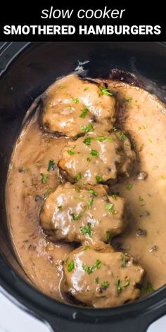 slow cooker meatballs smothered in gravy and garnished with parsley