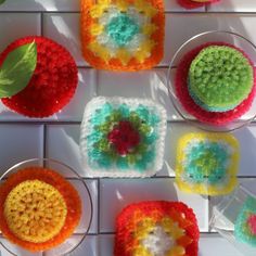 crocheted coasters are arranged on a tiled surface