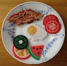 a white plate topped with different types of food on top of a wooden table next to an instagram post