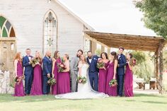 a group of people standing in front of a church