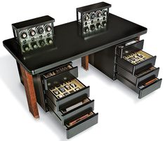 a black table with drawers and speakers on it