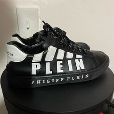 Exclusive Phillip Plein Contrasts Low Sneakers My Bf Literally Worn These Out Twice To Atlanta Fair Expo A Year Apart No Flaws Only Inside Shoe And Bottom Shoe Shoes Wear And Mild Fading On Back Label Purchased For 1200 When They Came Out Selling Cheap Because I Need Gone Asap Not Accepting Low Offers Listing Shows What They Are Selling For And Have Sold For Fast Shipper Size Eu 42 Designer Slip-on Sneakers For Streetwear, Designer Lace-up Sneakers With Vulcanized Sole, Logo Print Slip-on Sneakers For Streetwear, Slip-on Sneakers With Logo Print For Streetwear, Designer Sneakers With Vulcanized White Sole, Designer High-top Sneakers With Logo Print, Designer Synthetic Sneakers For Streetwear, Black Low-top Custom Sneakers With Logo Print, Leather Lace-up Skate Shoes With Logo Print