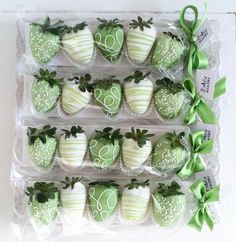 some green and white decorated strawberries in plastic bags