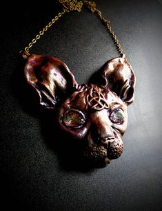 A mesmerizing sphinx cat necklace made out of polymer clay set with mystic topaz gemstones as eyes will enchant you.  Handmade out of polymer clay and magick! Celtic Triquetra, Sphinx Cat, Clay Set, Healing Necklace, Feather Pendant, Mystic Topaz, Cat Necklace, Healing Jewelry, Smokey Quartz