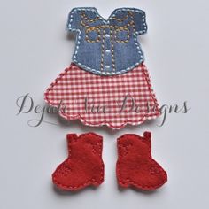 a red and white checkered dress with booties on the bottom is made out of fabric