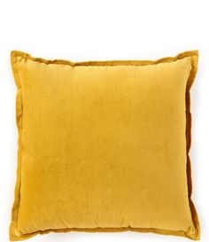 a yellow pillow on a white background