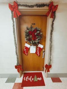 a door decorated for christmas with stockings and stocking