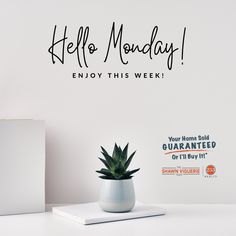 there is a potted plant on the table next to a white box and a sign that says hello monday enjoy this week