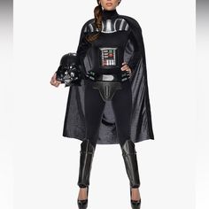 a woman dressed as darth vader is standing with her hands on her hips