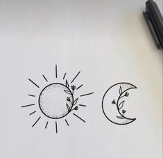 the sun and moon drawings are drawn on paper