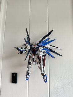 Display your Gundam models, action figures, or other toys in style with this one of a kind floating arm display. Designed to attach directly to Gundam models but can accommodate other models that mount from the bottom. Some modification may be required for other models. The arm protrudes 100mm and will allow most back accessories to be mounted to the Gundam figure.  3D printed in PLA with high infill for added strength. This is a two piece design with a mounting block and the display arm. Simply Gundam Toys, Toy Display, Command Strips, Peg Board, The Block