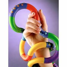 a hand holding an assortment of rings in front of a purple background with the word ring on it