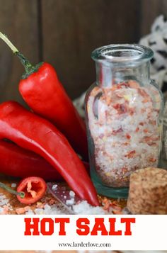 hot salt in a glass jar next to red peppers