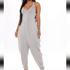 Heather Gray Colored Vneck Spaghetti Straps Racerback Super Stretchy Jumpsuit. Center Seam Stitching. Size Medium 95% Rayon 5% Spandex Solid Color V-neck Jumpsuits And Rompers For Leisure, Stretch V-neck Jumpsuits And Rompers For Loungewear, Casual V-neck Stretch Jumpsuits And Rompers, Trendy V-neck Bodysuit For Loungewear, Casual One-piece Bodysuit With Built-in Bra, Casual V-neck Bodysuit For Spring, Casual Bodysuit With Built-in Bra For Night Out, Casual Solid Color Backless Bodysuit, Casual V-neck Bodysuit For Loungewear