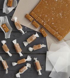 several pieces of caramel and white paper on a table