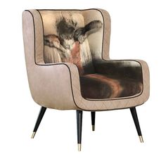 a brown chair with a painting on it's back and legs in front of a white background