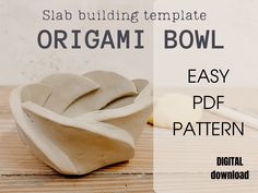 an origami bowl is sitting on a wooden table with the text, shab building template