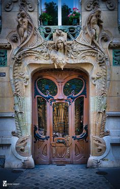 the front door to an ornately decorated building