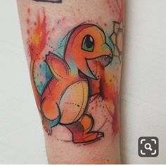 an arm with a colorful pokemon tattoo on it