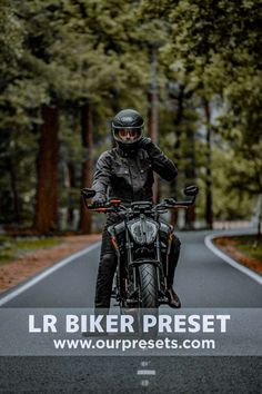 a man riding on the back of a motorcycle down a road