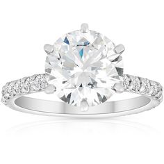 a white gold engagement ring with diamonds on it