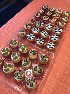 cupcakes are arranged in the shape of numbers on top of plastic trays