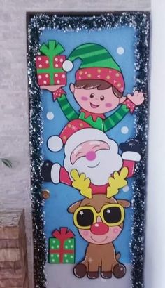 a door decorated with santa claus and reindeers