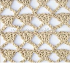 the crochet pattern is made up of two rows of small squares, one in beige