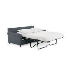 a couch with a pull out bed and mattress on it's back end, in front of a white background