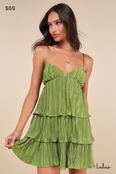 The undeniable party presence of the Lulus Sleek Dedication Green Satin Plisse Cutout Tiered Mini Dress means that it was made to own the dance floor! Luxe, plisse-pleated woven satin shapes this stunning dress that features a sleeveless bodice with an alluring V-neckline and adjustable spaghetti straps. The high, empire-style waist features trendy twin cutouts at the sides, all atop a tiered A-line skirt that finishes at a too-cute mini hem. Hidden back zipper/clasp. Fit: This garment fits true Green Hoco Dress, Cute Flowy Dresses, Tops Fall Outfits, Fall Trends Outfits, Tiered Mini Dress, Formal Dresses Short, Green Mini Dress, Wedding Guest Dresses, Green Satin