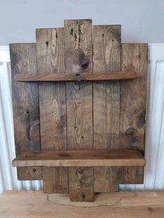 a wooden shelf made out of old pallets