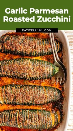 garlic parmesan roasted zucchini in a white casserole dish with a fork