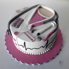 a cake decorated with medical equipment on top of a table