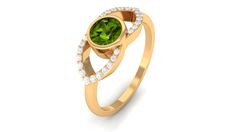 a gold ring with a green stone and diamonds