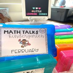 there is a sign that says math talks for children on the table in front of them