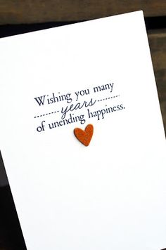 a card with an orange heart on it that says wishing you many years of unending happiness