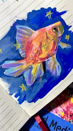 a drawing of a goldfish in blue water with stars on its back and bottom