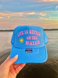 This adjustable OTTO trucker hat is so cute for summer time, it is adjustable and super comfy! It reads "Life is better on the water" in pink vinyl with a sunshine detail!! 🫶 Summer Trucker Hat, Trucker Hat Ideas, Ocean Inspired Jewelry, Custom Trucker Hats, Pink Vinyl, Hat Ideas, Ocean Inspired, Neat Ideas, Jacksonville Fl