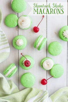 green cupcakes with white frosting and cherries on top are arranged in the shape of shamrock shake macarons