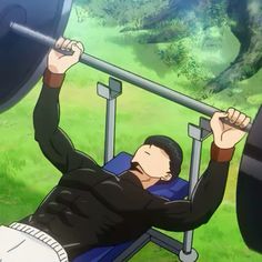 a man is laying down on a bench with a barbell