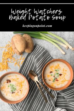 two bowls of soup with cheese on top and green onions next to it, one bowl is