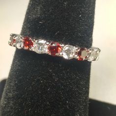 Stunning Sterling Silver Eternity Band. Ruby And Diamond Cz's. Size 6 Red Cubic Zirconia Jewelry For Promise Ring, Red Cubic Zirconia Promise Ring Jewelry, Red Cubic Zirconia Promise Ring, Red Crystal Ring With Accent Stones In Cubic Zirconia, Red Cubic Zirconia Crystal Ring, Adjustable Red Crystal Promise Ring, Red Cubic Zirconia Ring With Diamond Accents, Red Cubic Zirconia Crystal Ring With Prong Setting, Red Crystal Ring With Accent Stones