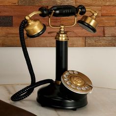 an old - fashioned phone is sitting on a table